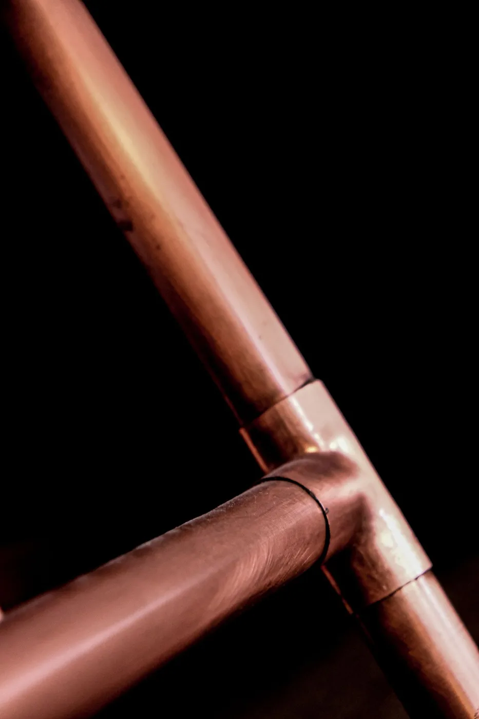 Close-up of a copper pipe and elbow connection